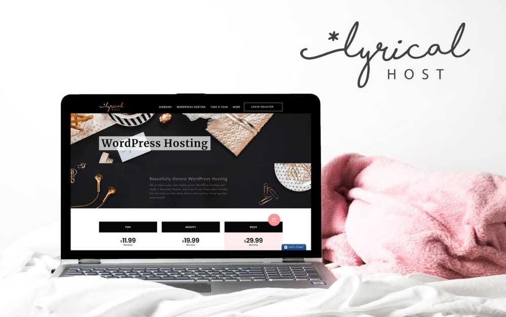 Mockup of Lyrical Host hosting web page on a grey laptop. The laptop is on top of a white sheet with a pink blanket in the background. The Lyrical Host logo is on the top right corner of the image. [Improve loading time for website, improve page loading time]